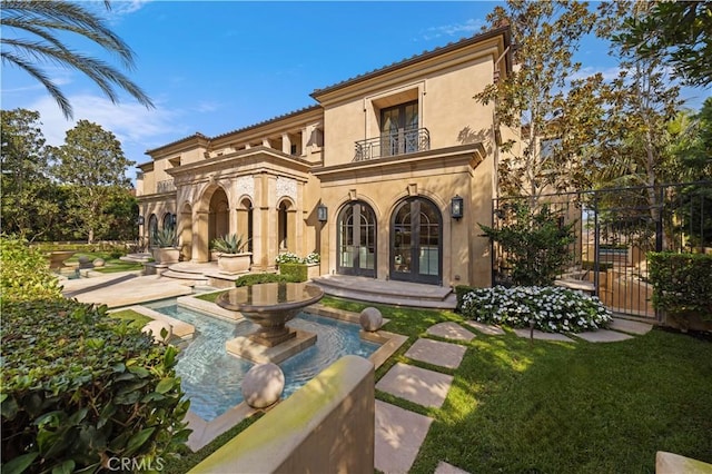 9 Shoreridge, Newport Coast, CA 92657 - back of house featuring a patio area, fence, stucco siding, french doors, and a balcony