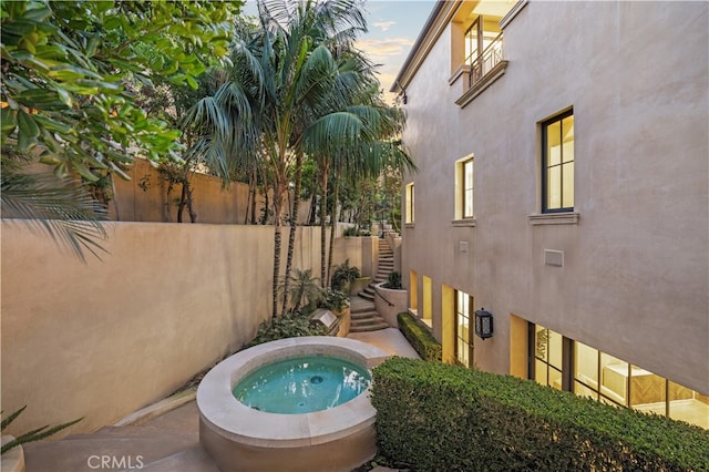 9 Shoreridge, Newport Coast, CA 92657 - view of pool with stairway, an outdoor hot tub, and fence