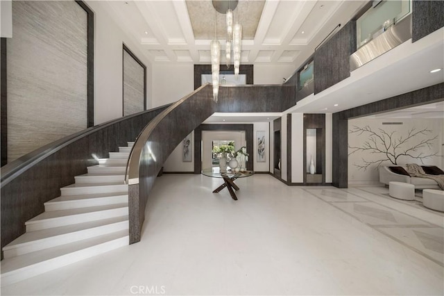 9 Shoreridge, Newport Coast, CA 92657 - staircase featuring a high ceiling, beam ceiling, and coffered ceiling