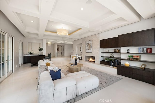 9 Shoreridge, Newport Coast, CA 92657 - living room with beamed ceiling, light tile patterned floors, a large fireplace, recessed lighting, and coffered ceiling