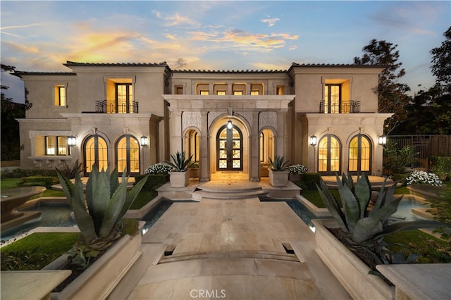 9 Shoreridge, Newport Coast, CA 92657 - mediterranean / spanish-style house with french doors, stucco siding, and a balcony
