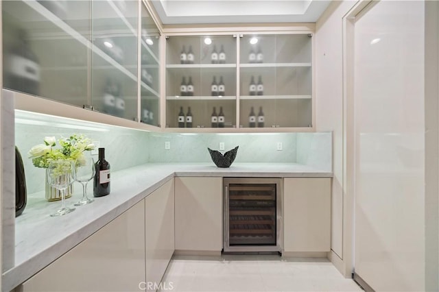 9 Shoreridge, Newport Coast, CA 92657 - bar with tasteful backsplash, a dry bar, beverage cooler, and light tile patterned flooring