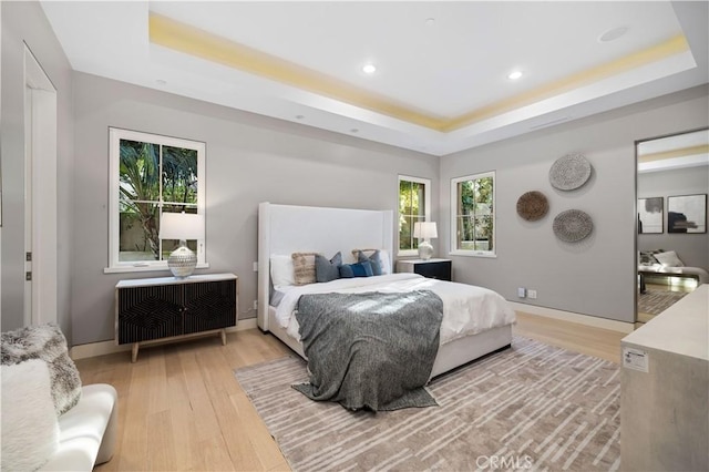 9 Shoreridge, Newport Coast, CA 92657 - bedroom featuring a tray ceiling, light wood finished floors, baseboards, and recessed lighting