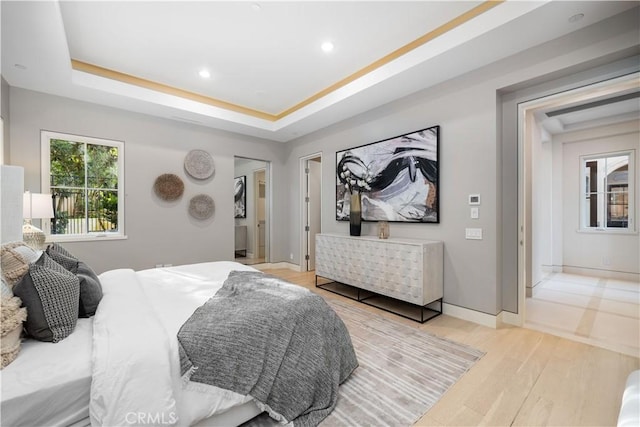 9 Shoreridge, Newport Coast, CA 92657 - bedroom featuring a tray ceiling, baseboards, recessed lighting, and wood finished floors