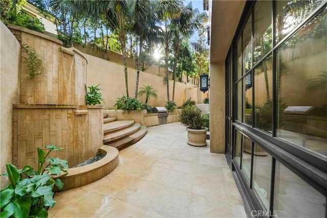 9 Shoreridge, Newport Coast, CA 92657 - view of patio / terrace featuring grilling area, an outdoor kitchen, and fence