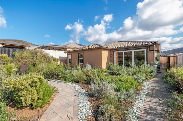 1373 Topanga Dr, San Marcos, CA 92069 - back of house featuring stucco siding and a tile roof