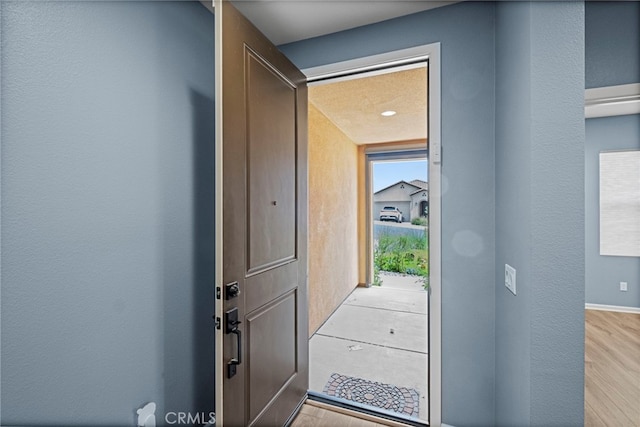 1373 Topanga Dr, San Marcos, CA 92069 - doorway with a textured wall and wood finished floors