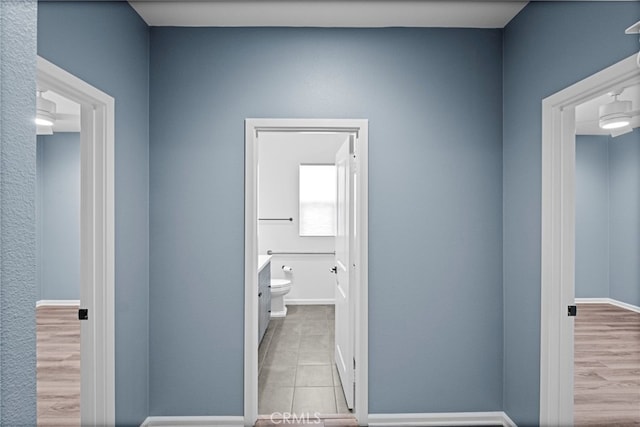 1373 Topanga Dr, San Marcos, CA 92069 - hallway with tile patterned floors and baseboards
