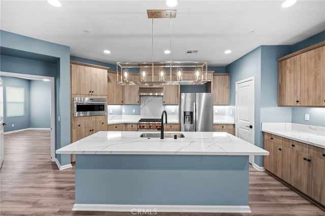 1373 Topanga Dr, San Marcos, CA 92069 - kitchen featuring stainless steel appliances, light stone counters, a kitchen island with sink, pendant lighting, and recessed lighting