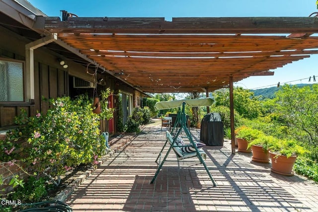 view of patio featuring a pergola