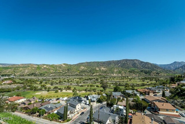 birds eye view of property with a residential view and a mountain view