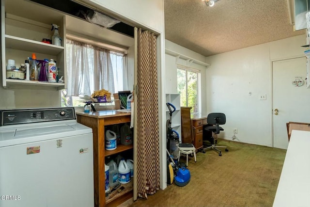 carpeted office space with washer / dryer and a textured ceiling