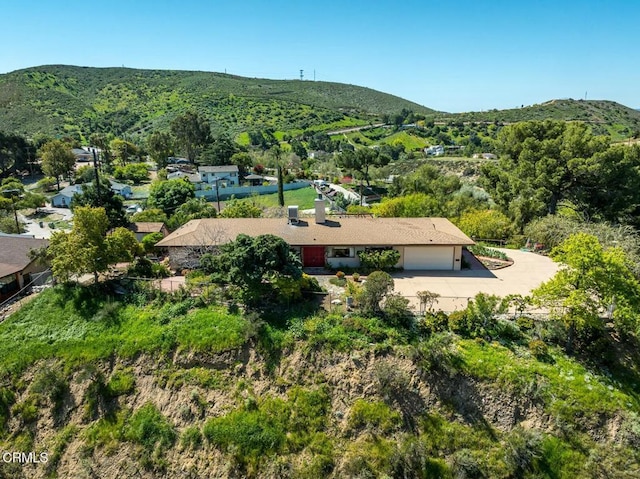 birds eye view of property featuring a mountain view