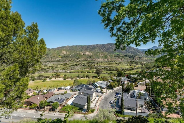 birds eye view of property featuring a mountain view