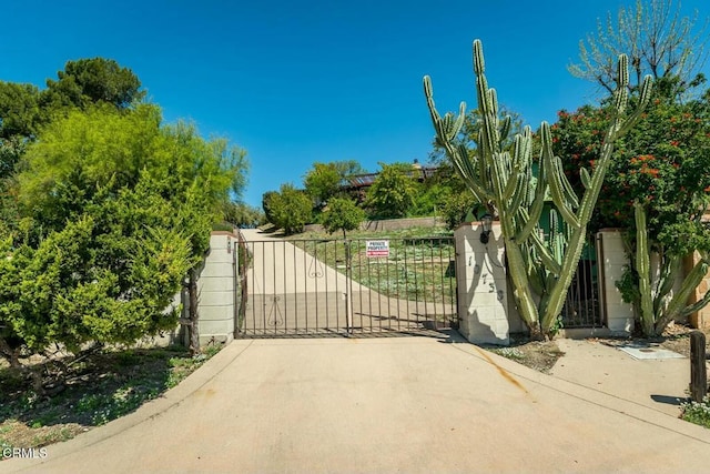 view of gate featuring fence