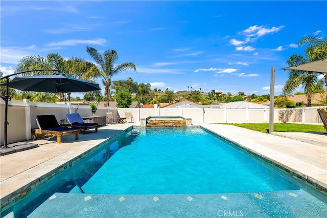 view of pool with a patio area, a fenced backyard, and a pool with connected hot tub