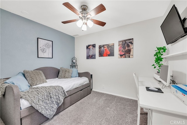 living room featuring ceiling fan, carpet, an office area, and baseboards