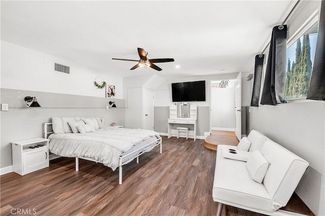 bedroom featuring multiple windows, dark wood-style floors, recessed lighting, ceiling fan, and baseboards