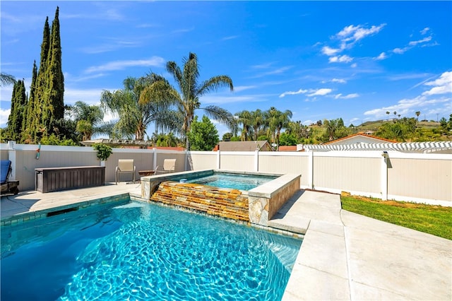 view of pool featuring an in-ground hot tub, a fenced backyard, and a patio
