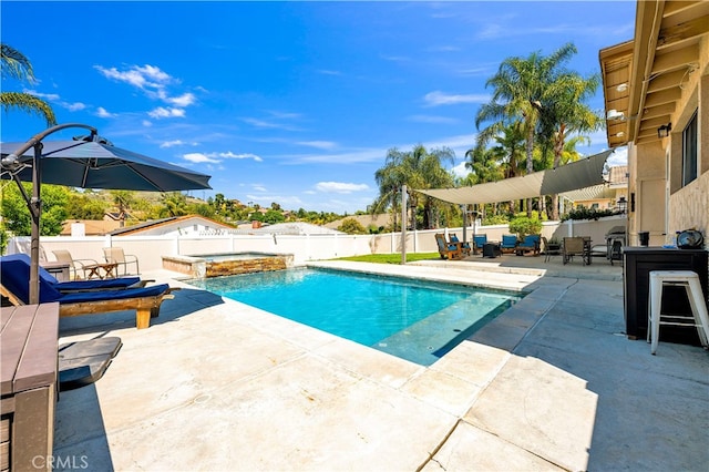 view of pool featuring an in-ground hot tub, a patio area, and a fenced backyard