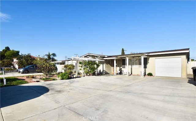11792 Seacrest Dr, Garden Grove, CA 92840 - view of front of property with a garage, driveway, stucco siding, and a pergola
