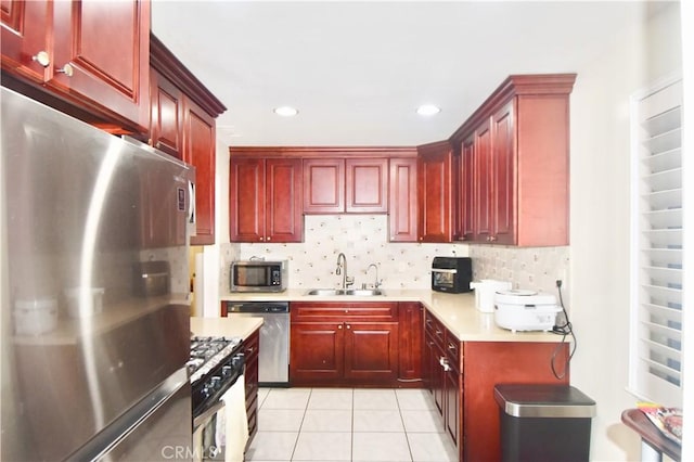 11792 Seacrest Dr, Garden Grove, CA 92840 - kitchen featuring stainless steel appliances, a sink, dark brown cabinets, light countertops, and recessed lighting