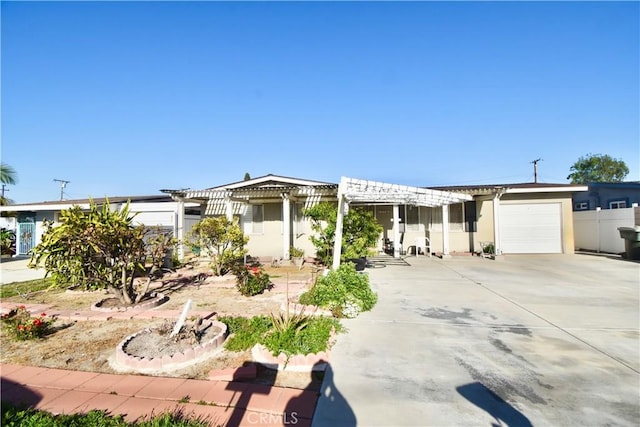 11792 Seacrest Dr, Garden Grove, CA 92840 - view of front of house featuring a garage, concrete driveway, a pergola, and stucco siding