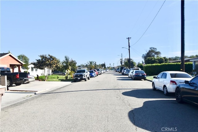 11792 Seacrest Dr, Garden Grove, CA 92840 - view of asphalt street featuring street lights, curbs, and sidewalks