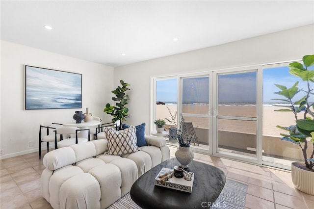 3012 W Oceanfront, Newport Beach, CA 92663 - living room with light tile patterned floors, recessed lighting, and baseboards