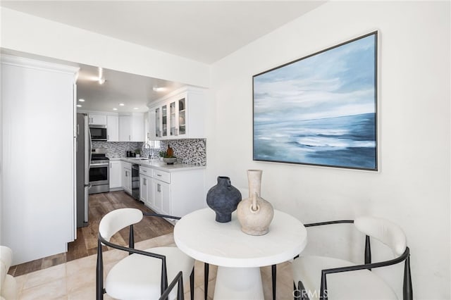 3012 W Oceanfront, Newport Beach, CA 92663 - dining space featuring wood finished floors and recessed lighting