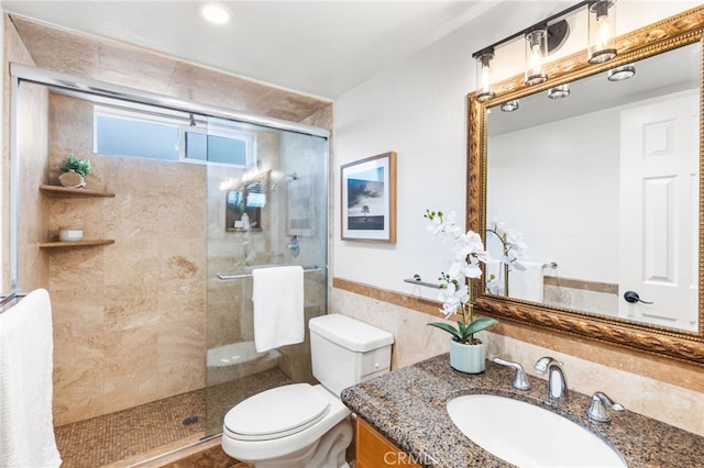 3012 W Oceanfront, Newport Beach, CA 92663 - full bathroom featuring tiled shower, toilet, vanity, tile walls, and a wainscoted wall