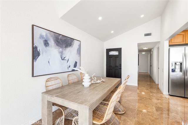 3012 W Oceanfront, Newport Beach, CA 92663 - dining area featuring light marble finish flooring, lofted ceiling, and recessed lighting