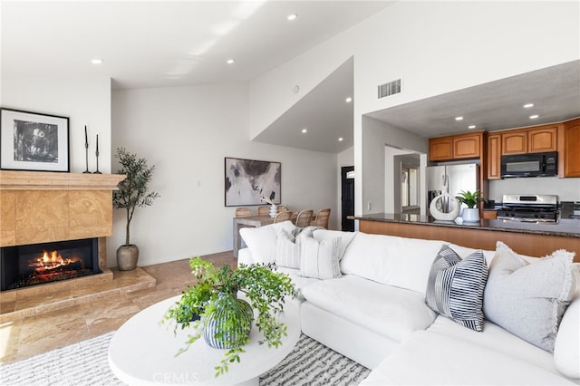 3012 W Oceanfront, Newport Beach, CA 92663 - living room with recessed lighting, a fireplace, baseboards, and high vaulted ceiling