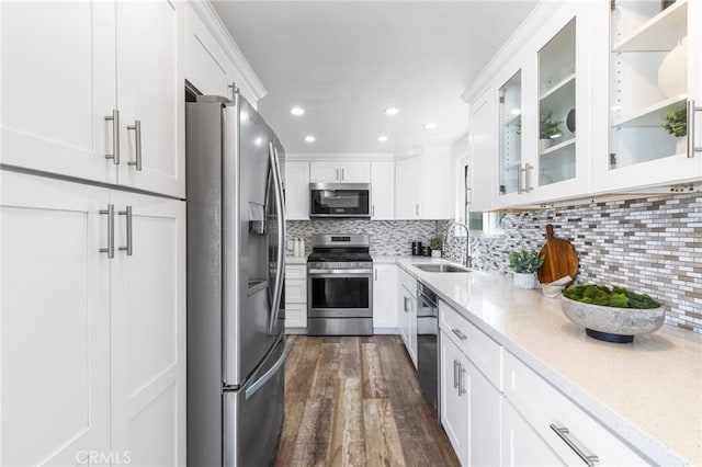 3012 W Oceanfront, Newport Beach, CA 92663 - kitchen featuring stainless steel appliances, a sink, white cabinets, dark wood-style floors, and recessed lighting