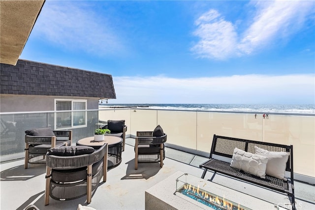 3012 W Oceanfront, Newport Beach, CA 92663 - view of patio featuring an outdoor living space with a fire pit and view of water and beach