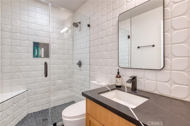 76010 Fairway Dr, Indian Wells, CA 92210 - bathroom featuring toilet, tasteful backsplash, tile walls, and a shower stall