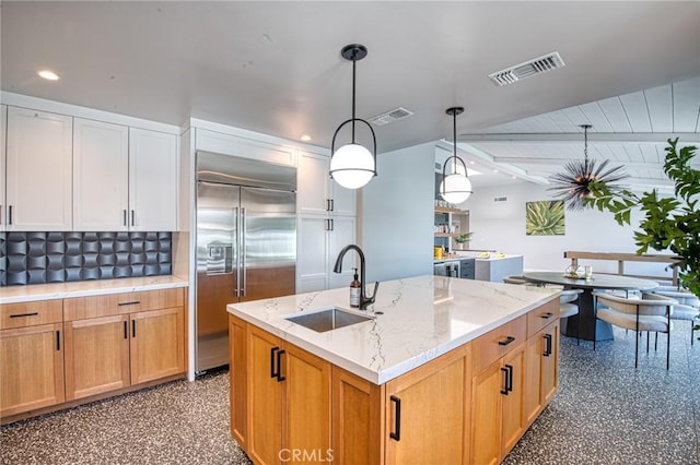 76010 Fairway Dr, Indian Wells, CA 92210 - kitchen with a sink, visible vents, hanging light fixtures, and built in fridge