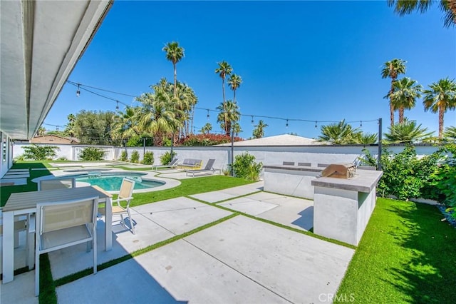 76010 Fairway Dr, Indian Wells, CA 92210 - view of patio with an outdoor kitchen, a fenced backyard, and a fenced in pool
