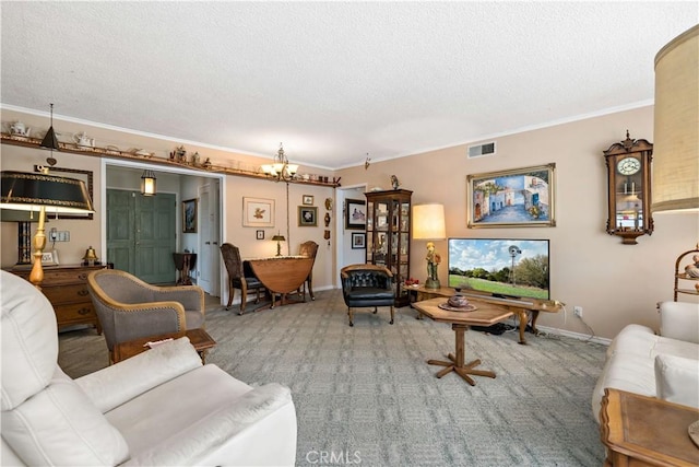 living room with a chandelier, visible vents, and ornamental molding