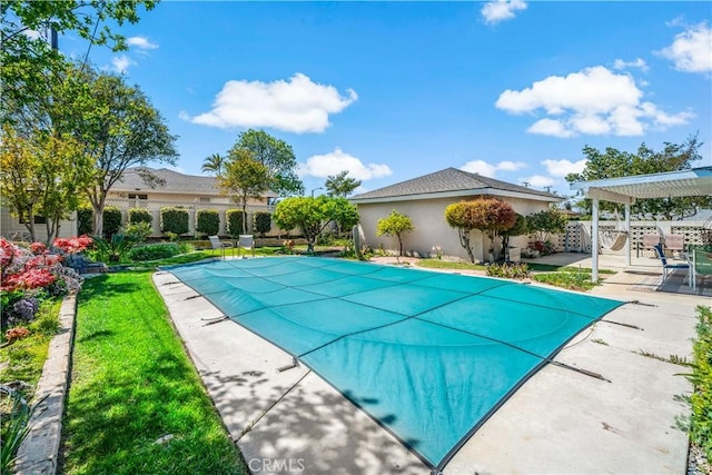 view of swimming pool with a pergola, a patio, fence, and a fenced in pool
