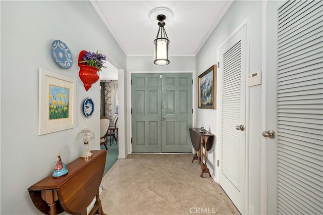 foyer featuring ornamental molding
