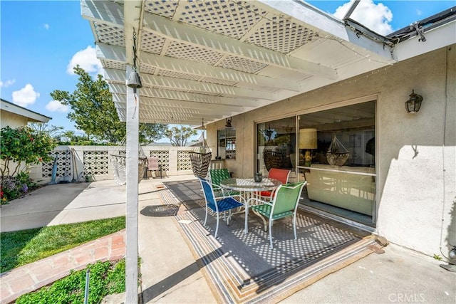view of patio featuring outdoor dining area