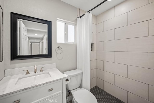 15021 Eureka St, Lake Elsinore, CA 92530 - bathroom featuring toilet, tiled shower, and vanity