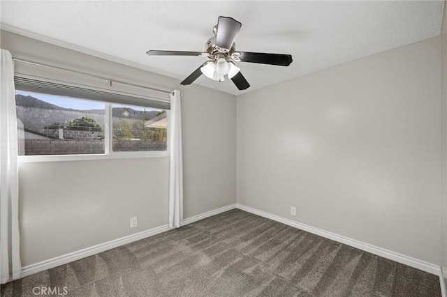 15021 Eureka St, Lake Elsinore, CA 92530 - spare room featuring carpet floors, baseboards, and a ceiling fan