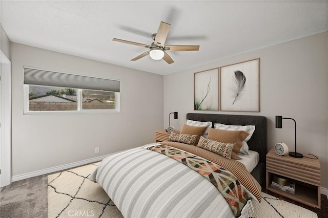 bedroom featuring baseboards, carpet flooring, and ceiling fan