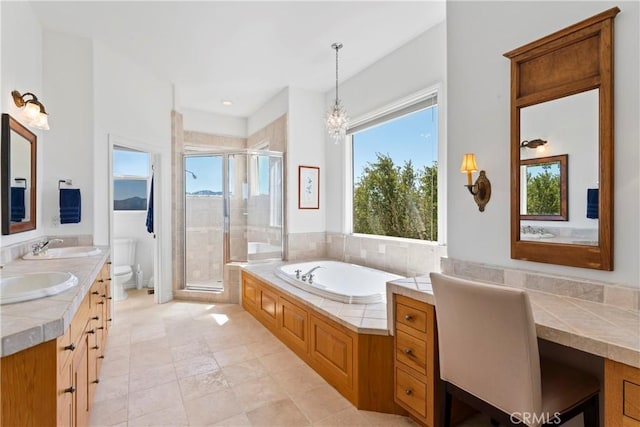 29083 Mammoth Dr, Lake Arrowhead, CA 92352 - full bathroom with a garden tub, a shower stall, double vanity, and a chandelier