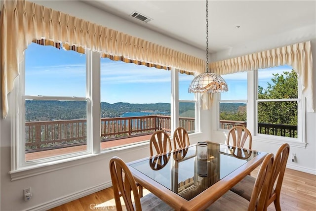 29083 Mammoth Dr, Lake Arrowhead, CA 92352 - dining room featuring wood finished floors and plenty of natural light