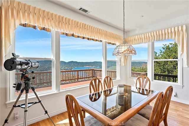 29083 Mammoth Dr, Lake Arrowhead, CA 92352 - dining area featuring wood finished floors and healthy amount of natural light
