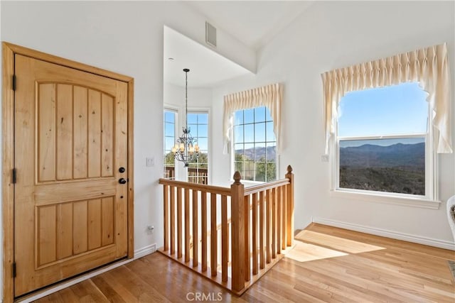 29083 Mammoth Dr, Lake Arrowhead, CA 92352 - entryway featuring a chandelier and wood finished floors