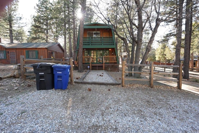 206 Cedar Ln, Sugarloaf, CA 92386 - exterior space featuring fence, a wooden deck, and a balcony